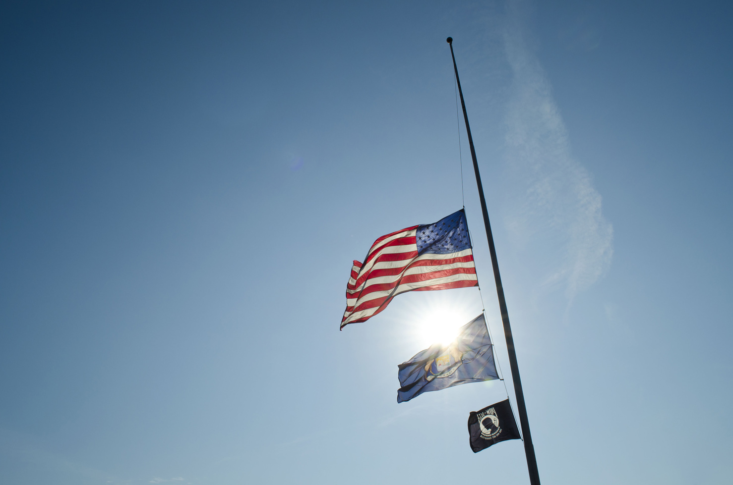 Flags fly at half staff on KCC's North Avenue campus in Battle Creek.
