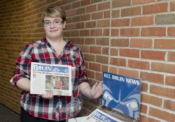 A student delivering the Bruin student newspaper.