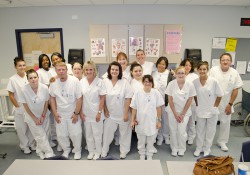 CNA students pose for a group photo in class.