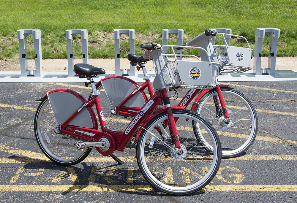 Two new red bikes, part of KCC's new B-cycle bike-sharing station, a system that lets users check bikes out for a fee for riding.