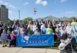 A group photo of KCC's Cereal Festival parade-walking group posing before the parade in 2014