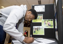 A student fills out an information form at the 2014 Volunteer and Civic Engagement Fair