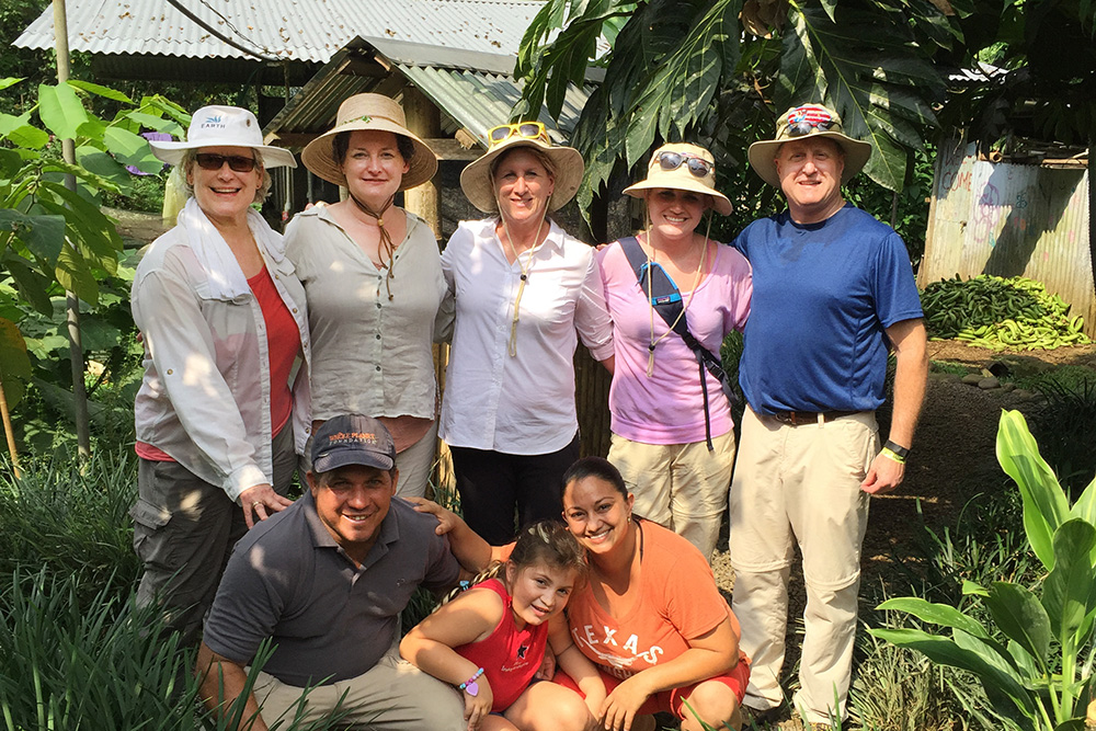 A group of KCC employees pose on a farm in Costa Rica.