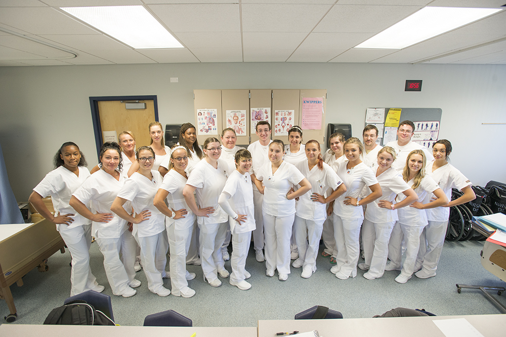 CNA students pose for a group photo during class.