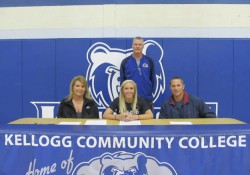 Pictured, from left to right, are Beverly Rook (mother), women's basketball player Kimi Rook, KCC's head women's basketball coach Klingaman and John Rook (father).