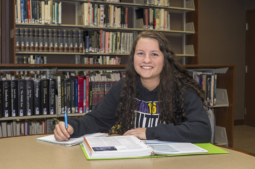 KCC student Brittany Doyle poses for a photo in the KCC library.