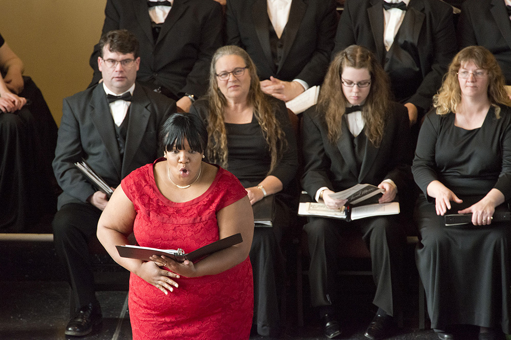 Music instructor Carmen Bell sings onstage during a performance at a church in downtown Battle Creek.
