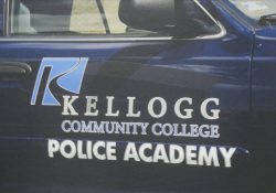 The side of a KCC Police Academy cruiser.