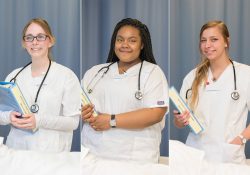 CNA students pose in the CNA Lab on campus in Battle Creek.