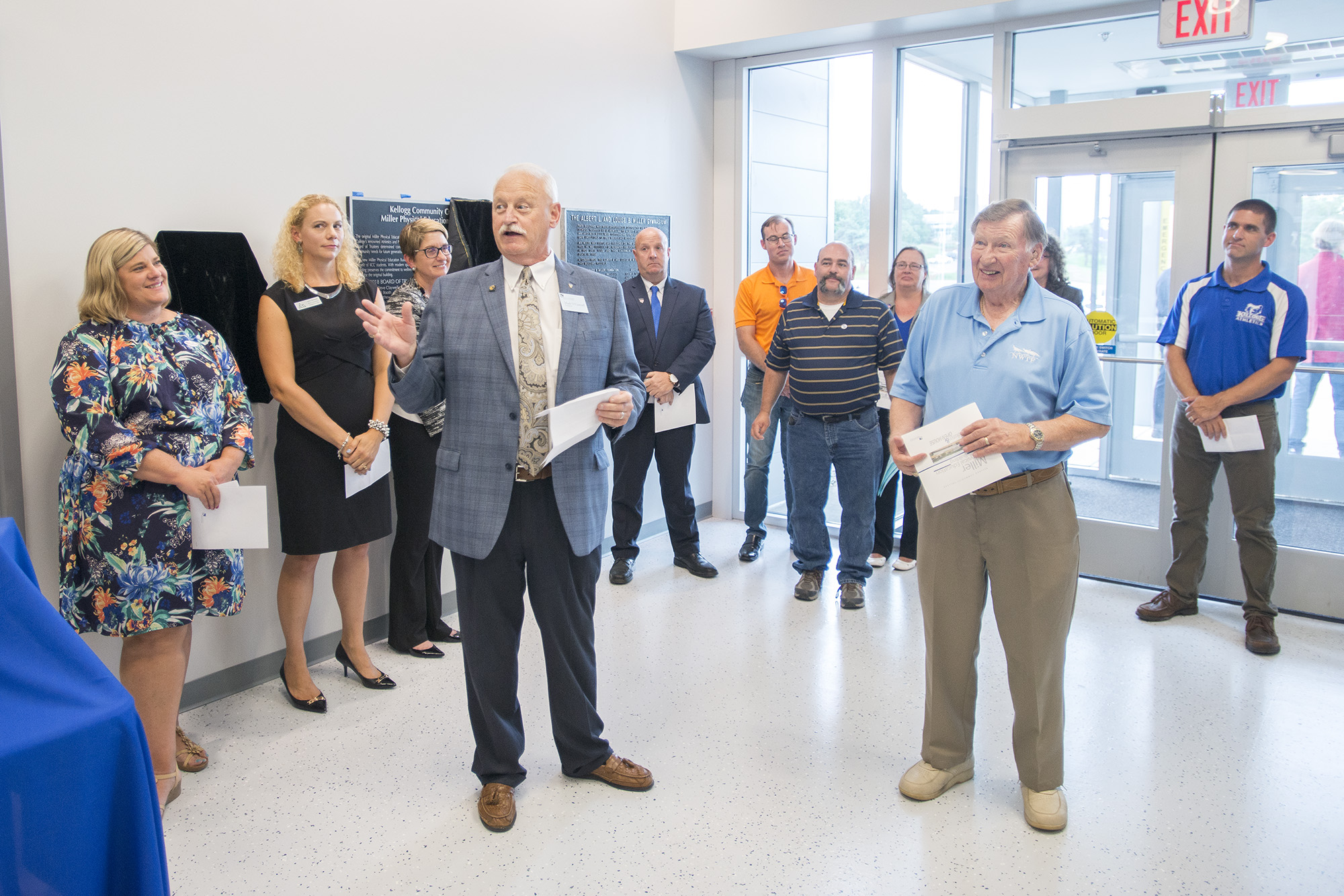KCC President Mark O'Connell, front left, recognizes Al Bobrofsky, front right, during KCC's Miller Building open house and dedication event Aug. 7.