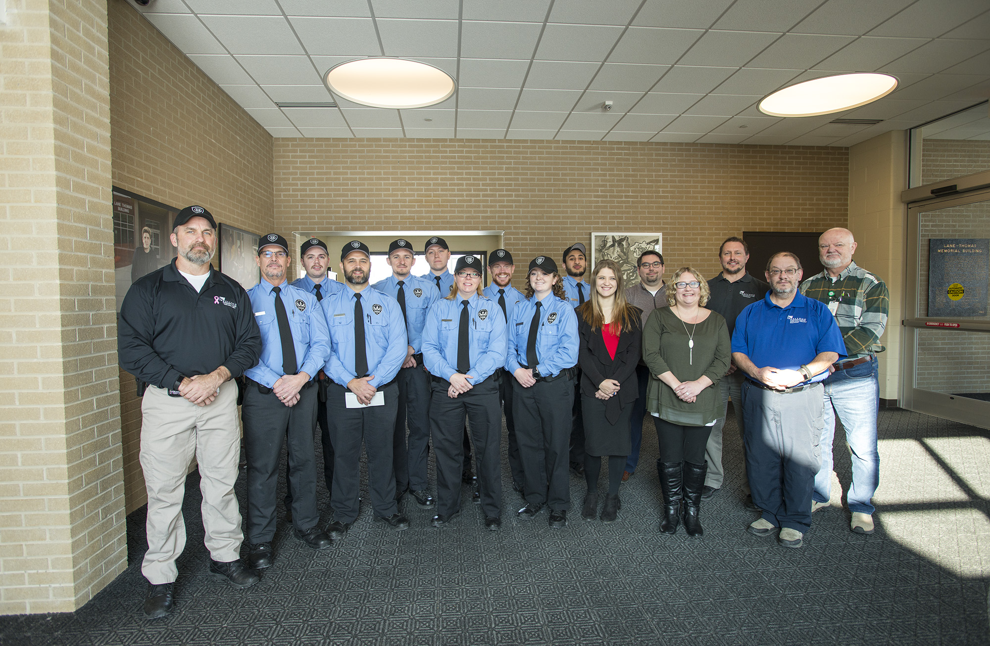 KCC Public Safety Education students and staff pose for a large group photo with S.A.F.E. Place shelter director and legal advocate Melissa Smith.
