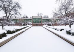 An exterior view of the main entrance to KCC's North Avenue campus in Battle Creek, blanketed in snow.