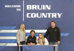 Pictured, from left to right, are Danielle Willis (mother), Head Women's Soccer Coach Eierí Salivia, Baylee Willis and Mitch Willis (father).
