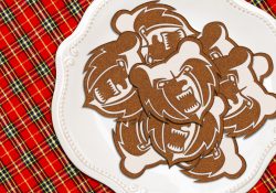 Holiday cookies shaped like KCC's Bruin head logo, on a plate.