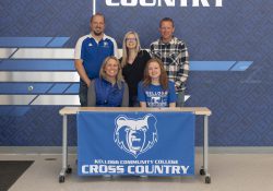 In the front row, from left to right, are Head KCC Cross-Country Coach Erin Lane and Kennedy VanderLugt. In the back row, from left to right, are Plainwell High School Girls Cross-Country Coach Brett Beier, Jeanna VanderLugt (mother) and Ben VanderLugt (father).