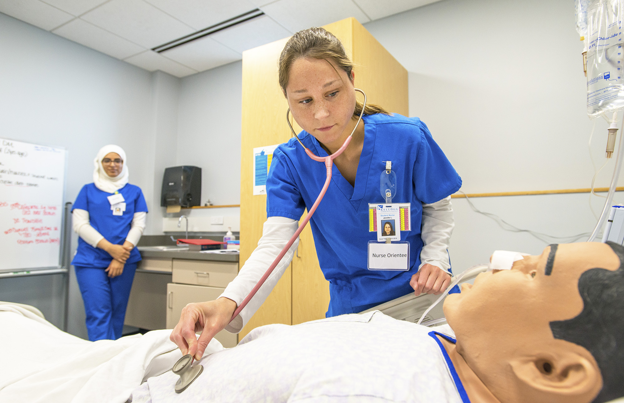 KCC Nursing students work with a patient simulator in a Nursing Lab on campus.