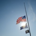 Flags fly at half staff on KCC's North Avenue campus in Battle Creek.