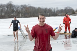 Police Academy Manager Rob Miller poses after his second jump in the lake on Saturday.