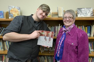 KCC English instructor Pam Feeney, right, and her former student Thomas Graham pose with their book.