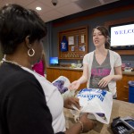 A student makes a purchase at KCC's Bruin Bookstore on Monday, Aug. 19, 2013, the first day fall semester books were available at the bookstore.