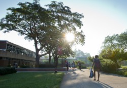 Students walk to morning classes past the reflecting pools outside of the North Avenue campus in Battle Creek