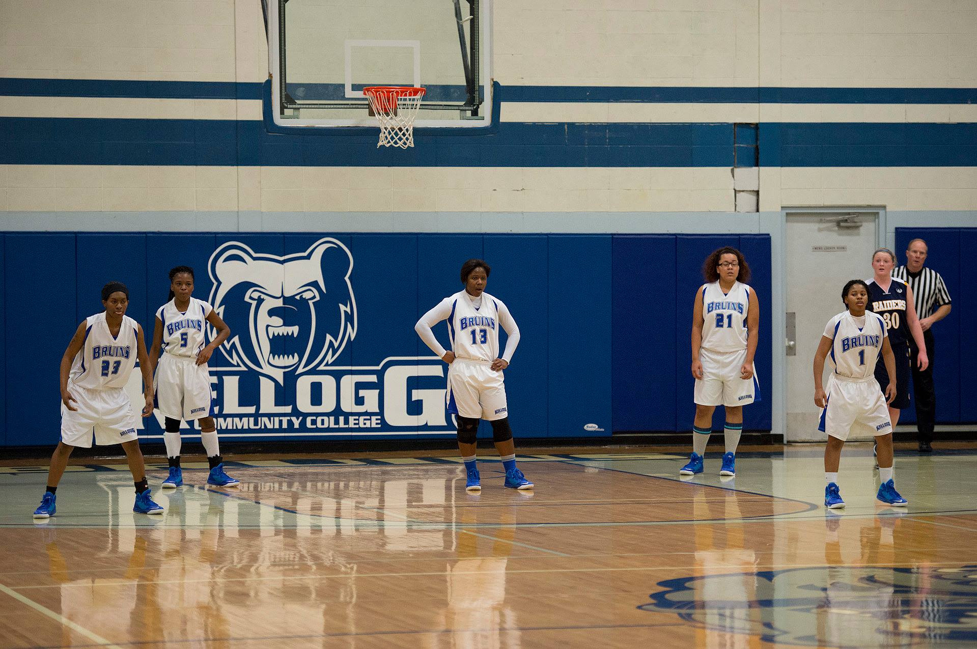 Women's basketball players on court during a game.
