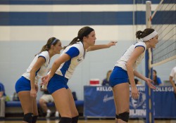 KCC volleyball players wait during a match at the Miller Gym.