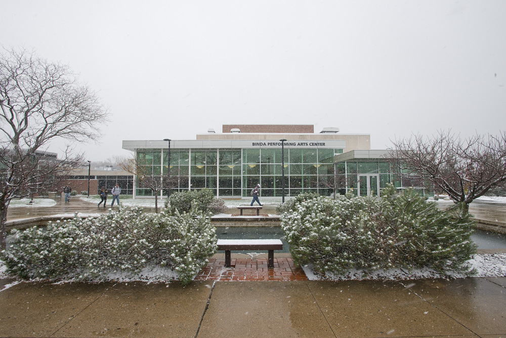 An exterior view of the Binda Theatre while it's snowing outside.
