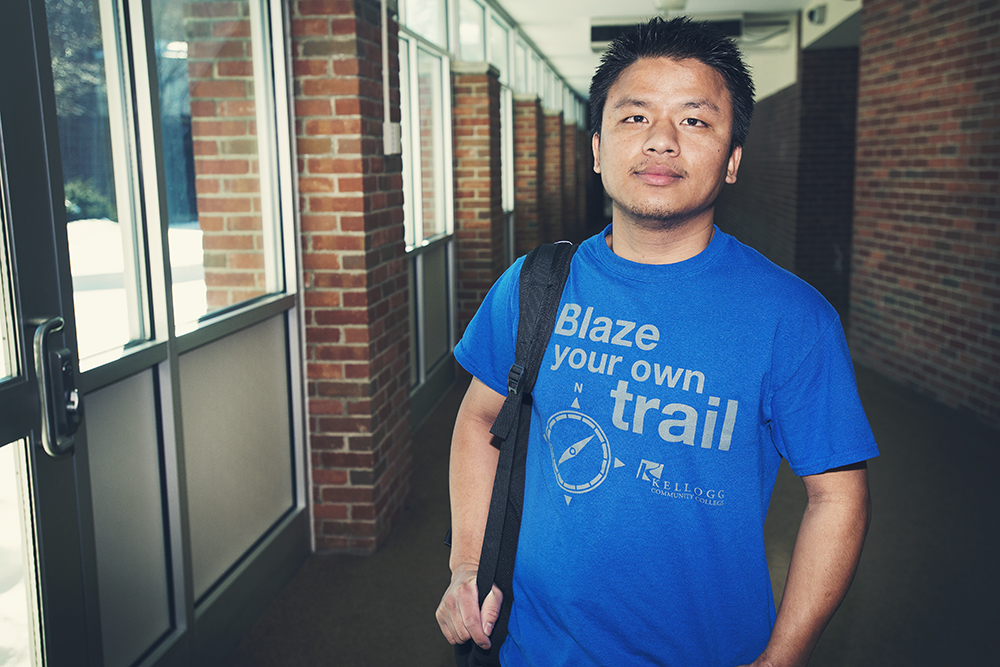 Trustee Scholarship recipient Hlum Khim poses for a photo in a hallway on the North Avenue campus.