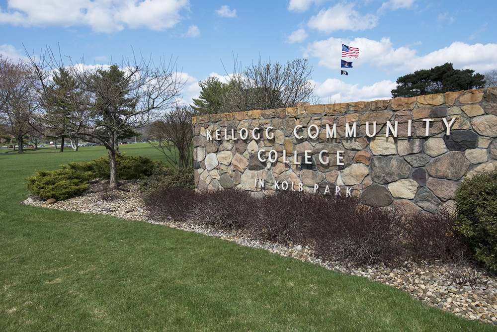 The front sign of KCC just off North Avenue on a sunny summer day.