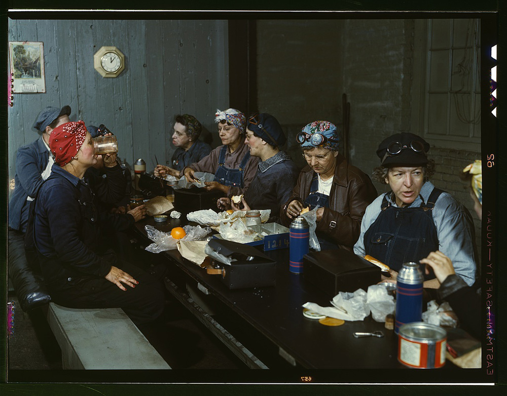 A Library of Congress photo from 1943 titled "Women workers employed as wipers in the roundhouse having lunch in their rest"