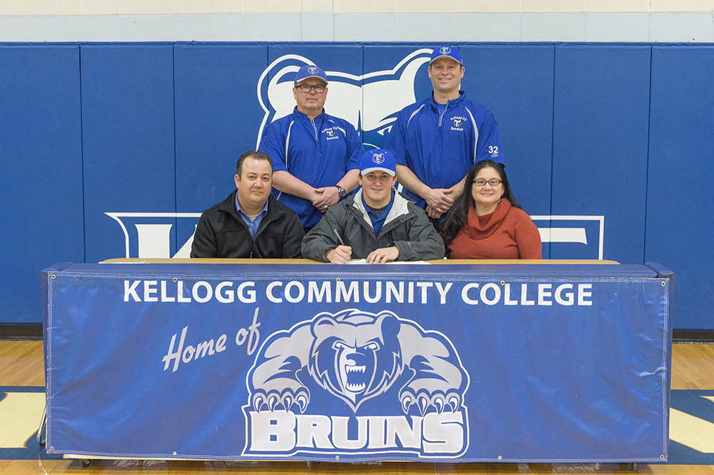 New KCC baseball signee Chris Clark poses in a KCC signing photo with KCC baseball coaches and some family members
