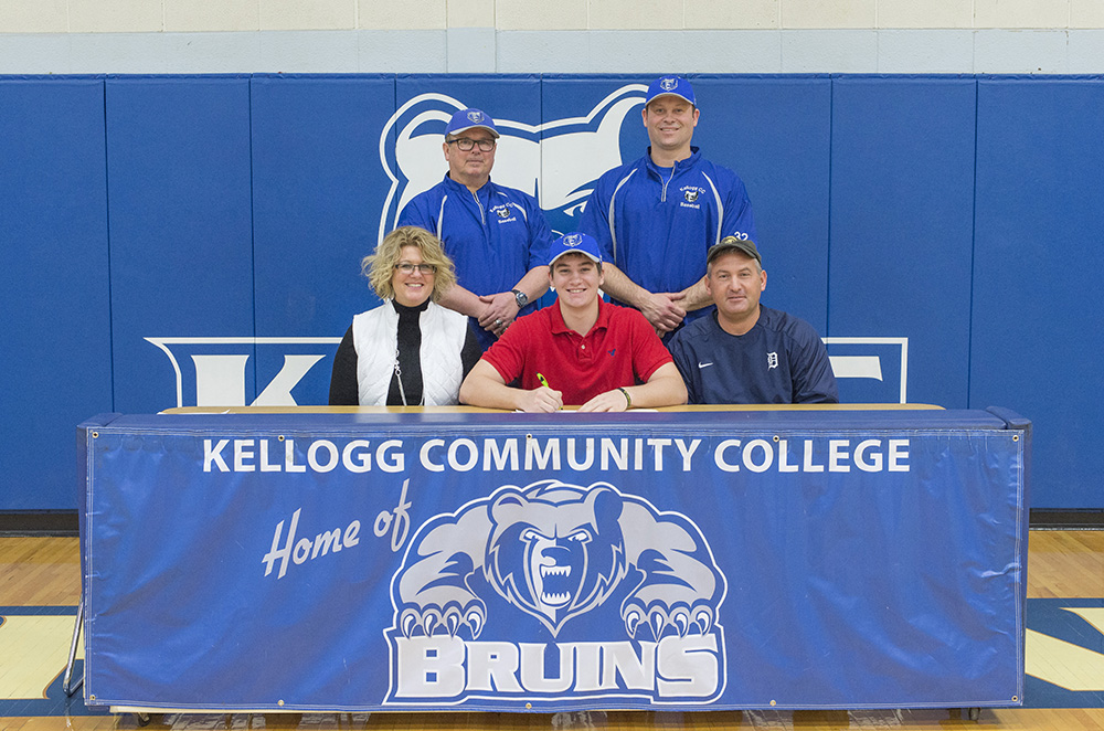 New KCC baseball signee Cooper Marshall poses in a KCC signing photo with KCC baseball coaches and some family members