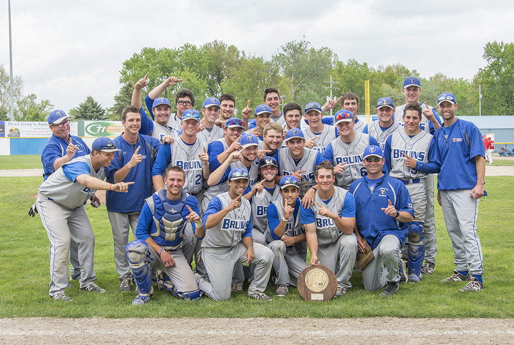 KCC's 2015 baseball team poses for a celebratory team photo on the field of C.O. Brown Stadium following their regional tournament win