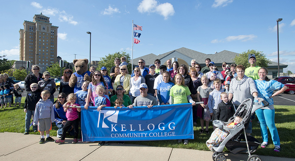 A group photo of KCC's Cereal Festival parade-walking group posing before the parade in 2014