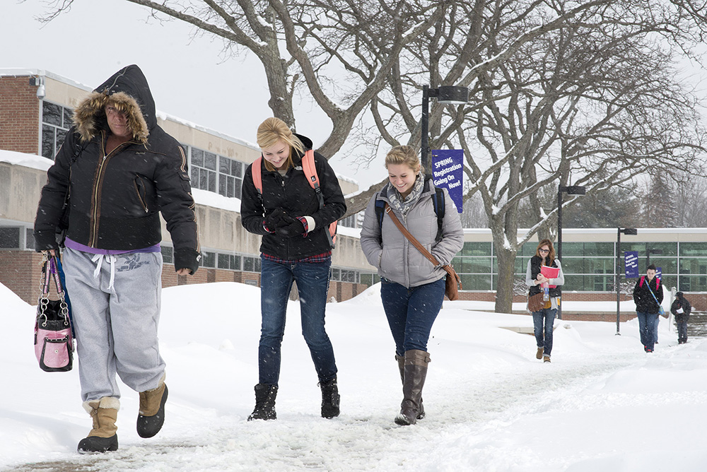 KCC students walk in the snow on the North Avenue campus in Battle Creek.