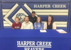 KCC volleyball player Kim Kusler signs a National Letter of Intent to play volleyball at KCC.