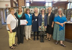 Pictured above, library staff pose with an organ donor quilt in the library following last year’s Michigan Libraries for Life event at KCC.