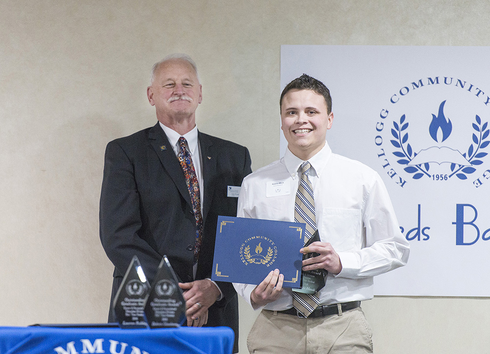 Hunter Mauk, right, accepts the award for Outstanding Full-Time Arts & Sciences Graduate from KCC President Mark O’Connell at the KCC Awards Banquet in April.