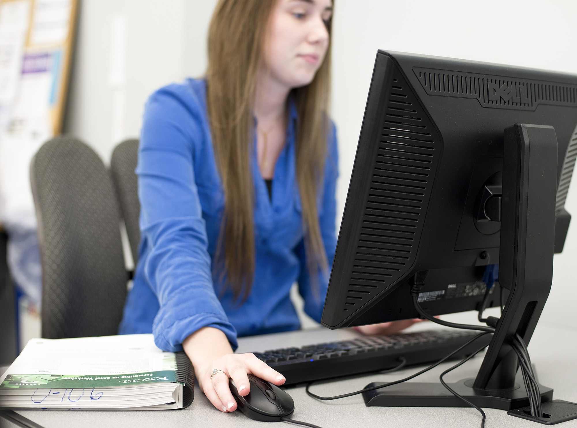 A student works on a computer in a KCC computer lab.