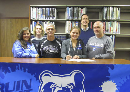Pictured from left to right are Jeanine Winkler (mother); Jeremy Winkler (brother); Attack Basketball coach Alton Tucker; KCC women's basketball recruit Nina Winkler; head KCC women’s basketball coach Dic Doumanian; and Jeff Winkler (father).