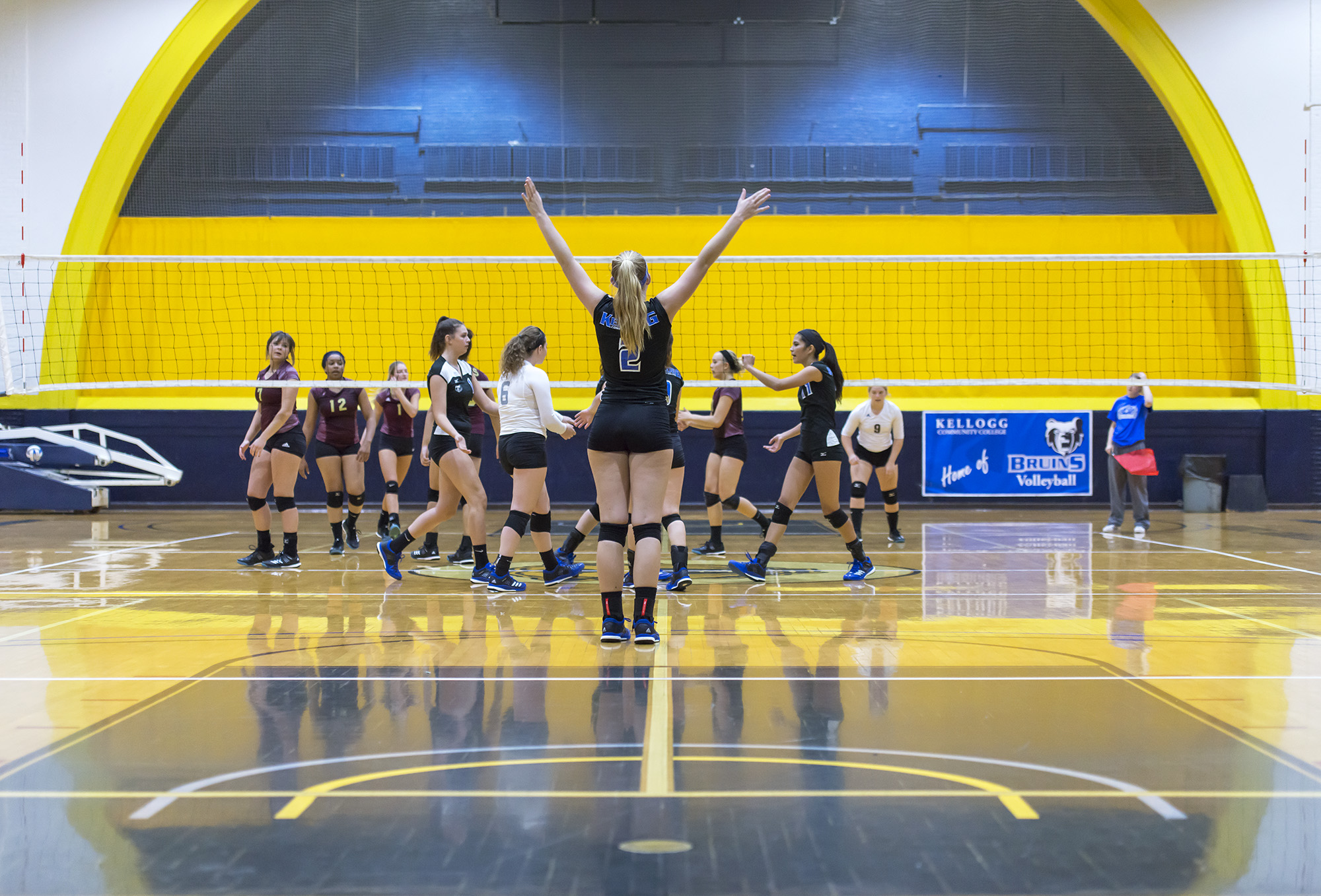 KCC volleyball players celebrate a point against Jackson College.