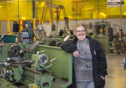 KCC student Karen Kelley poses for a photo at the Regional Manufacturing Technology Center campus in Battle Creek.