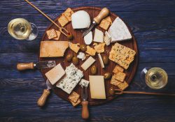 A stock photo featuring an overhead view of a cheese plate.