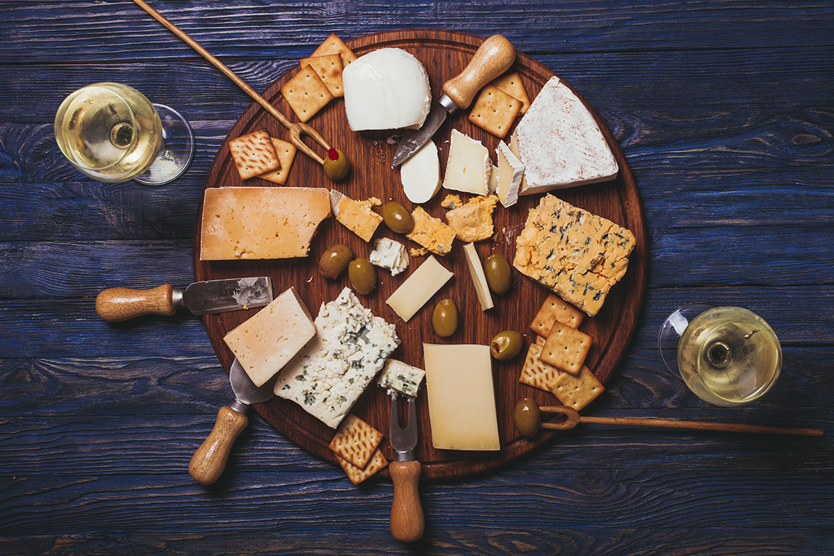 A stock photo featuring an overhead view of a cheese plate.