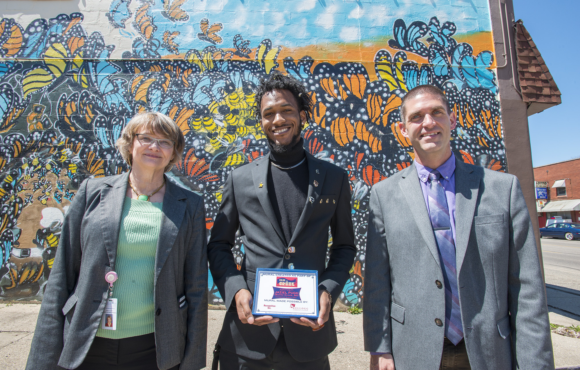 Pictured, from left to right, are KCC Media Design Manager Kathy Jarvie, artist Jaziel Pugh and KCC Director of Public Information and Marketing Eric Greene.