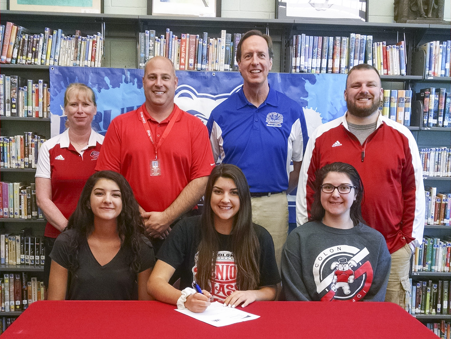 Pictured in the above photo, in the front row, from left to right, are Grace Smith (sister), Lyndsay Smith and Allyah Smith (sister). In the back row, from left to right, are Colon Junior/Senior High School Athletic Director Paige Smolarz, Colon Junior/Senior High School Principal Mike Rasmussen, KCC’s Head Women’s Basketball Coach Dic Doumanian and Colon’s Varsity Girls Basketball Coach Robbie Hattan.