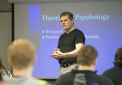 Psychology professor Donn Montgomery leads a class on the North Avenue campus in Battle Creek.