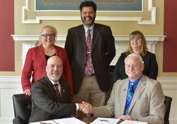 Olivet College and Kellogg Community College signed an agreement on Feb. 19 to expand the two institutions’ nursing program partnership. Pictured seated, from left to right, are President Steven M. Corey, Ph.D., Olivet College; and President Mark O’Connell, Kellogg Community College. Standing, from left to right, are Provost and Dean of the College Maria G. Davis, Ph.D., Olivet College; Dr. Paul Watson, Kellogg Community College vice president of instruction; and Dr. Lorraine Manier, Olivet College director of nursing education.