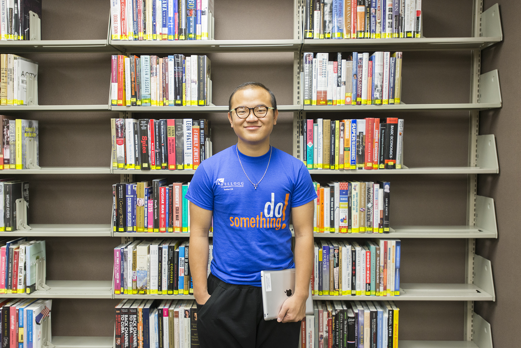 KCC alumnus Joseph Lin poses in the library as a student in 2015.